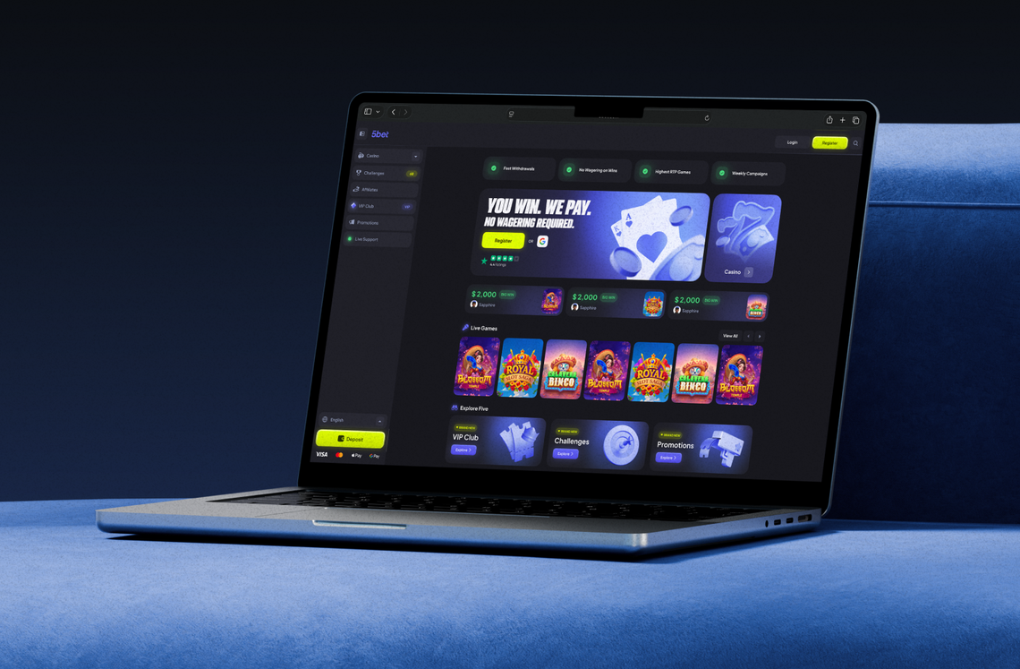 5Bet website shown on a laptop, with promo banners, live games and VIP club